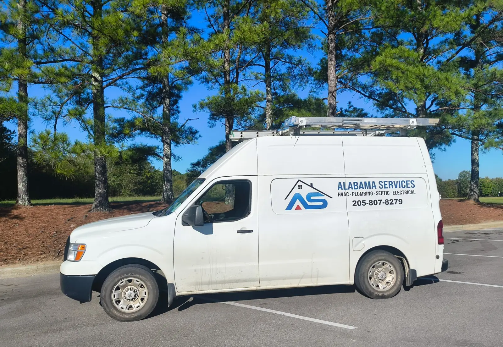 Alabama Services work van with a ladder rack