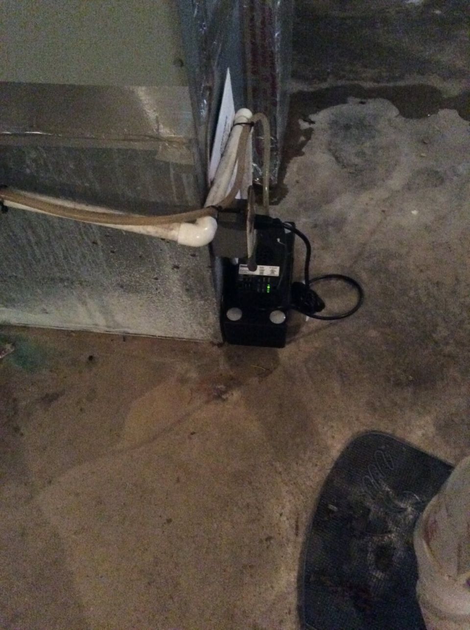 Clogged AC Drain Trap Leaking in a Basement